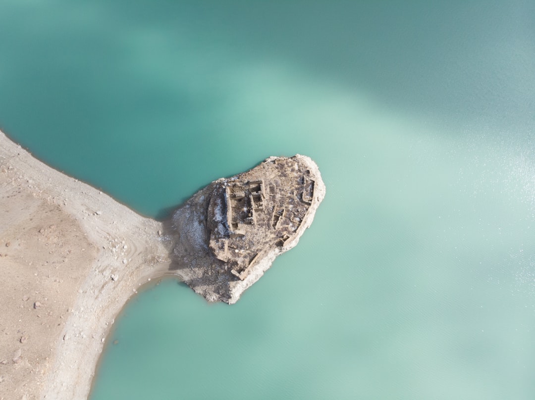 Aerial view of a small island surrounded by turquoise waters